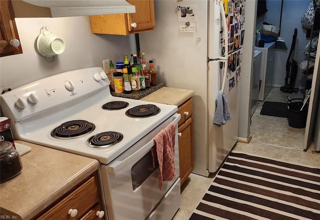 kitchen featuring white electric range oven, brown cabinets, extractor fan, light countertops, and light tile patterned flooring