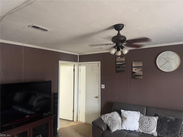 living room featuring crown molding and ceiling fan