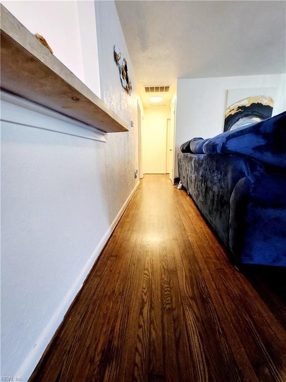 corridor with wood-type flooring