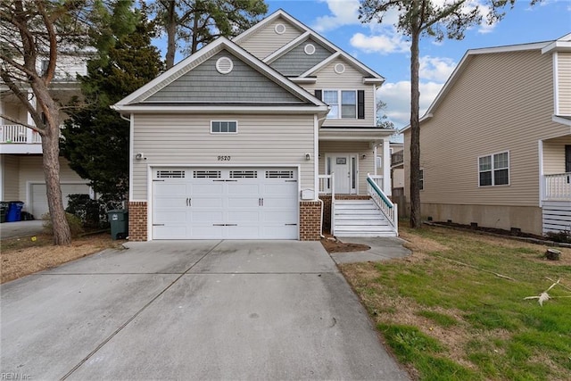 view of front of home with a garage, driveway, brick siding, and a front yard