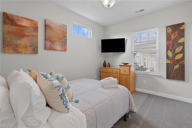 bedroom featuring carpet, visible vents, and baseboards