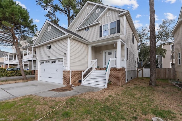 view of front of property featuring concrete driveway, fence, and a front lawn