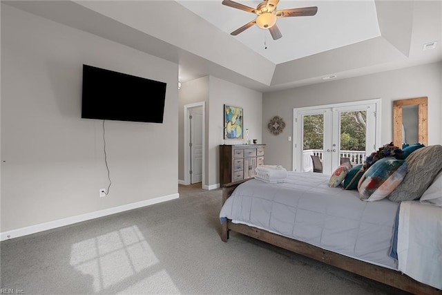 carpeted bedroom featuring a ceiling fan, baseboards, access to outside, french doors, and a raised ceiling