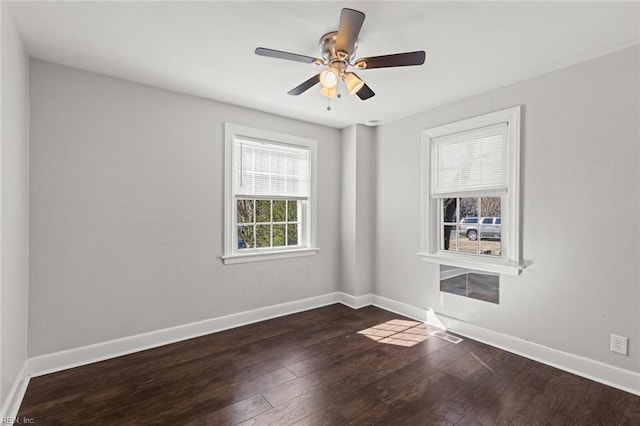 unfurnished room with dark hardwood / wood-style flooring and ceiling fan