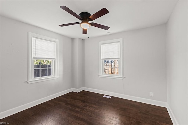 spare room with ceiling fan and wood-type flooring