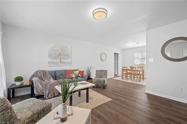 living room featuring dark wood-type flooring