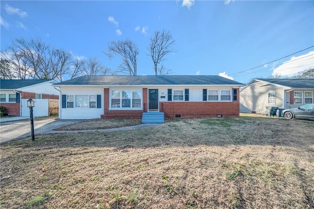 ranch-style home with a front lawn