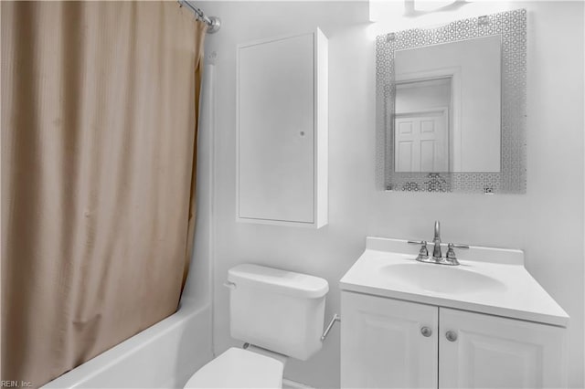 full bathroom featuring vanity, shower / tub combo, and toilet