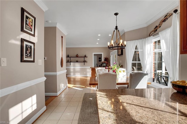 dining room with a chandelier, light tile patterned flooring, recessed lighting, baseboards, and crown molding