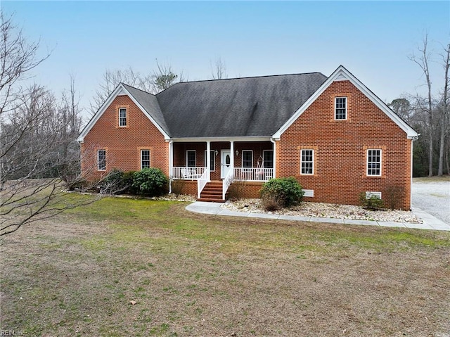 view of front facade featuring crawl space, a front lawn, a porch, and brick siding