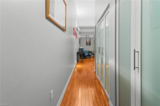 hallway featuring light hardwood / wood-style flooring