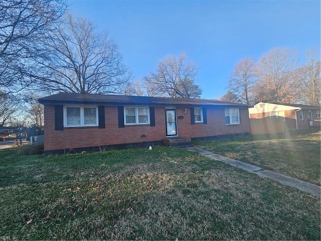 single story home featuring a front yard