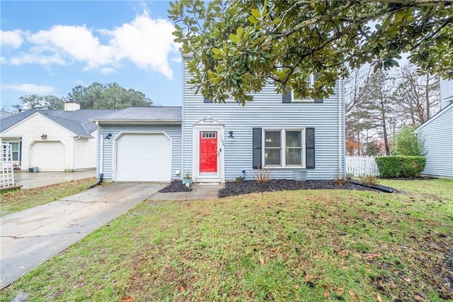 view of front of home featuring a garage and a front lawn