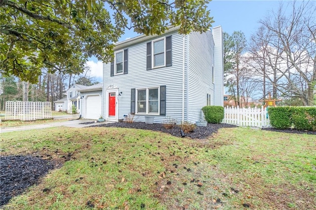 view of front of home featuring a garage and a front lawn