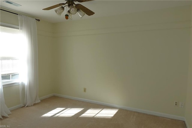 empty room with light carpet and ceiling fan