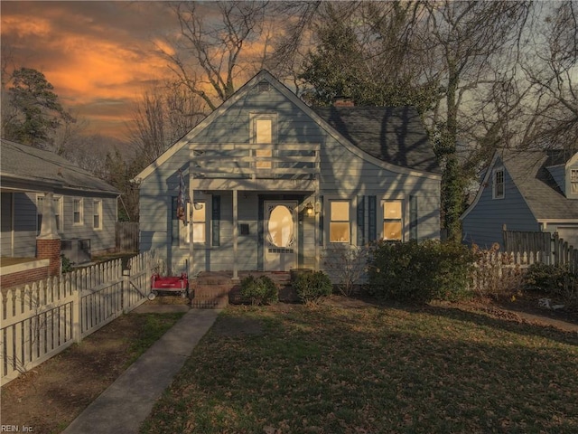 bungalow-style house with a yard