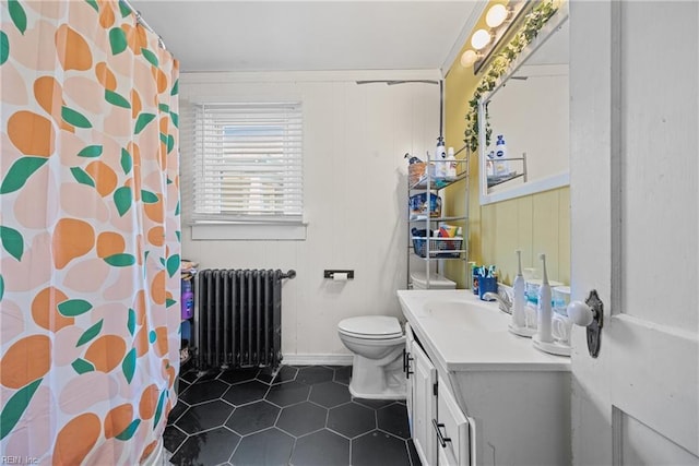 bathroom with vanity, radiator, tile patterned floors, and toilet