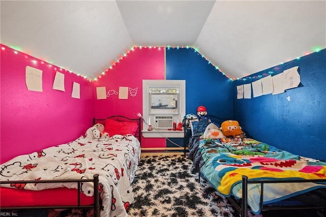 bedroom with cooling unit, carpet floors, and vaulted ceiling