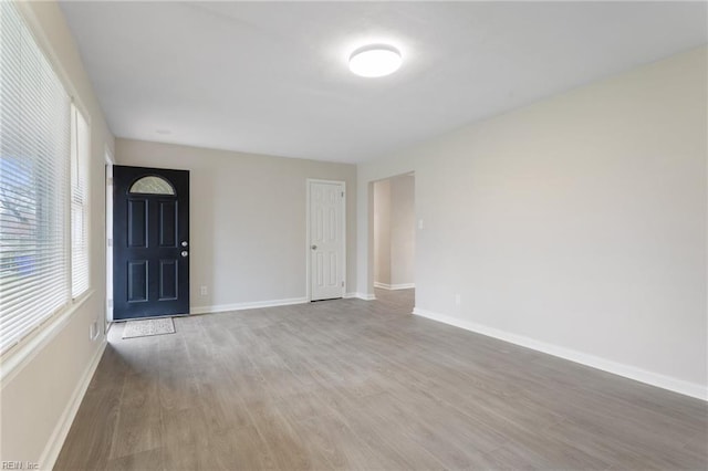 unfurnished room with light hardwood / wood-style floors