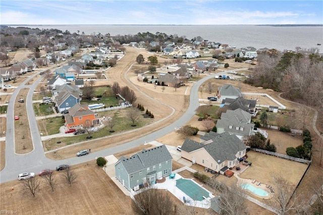 bird's eye view with a water view and a residential view