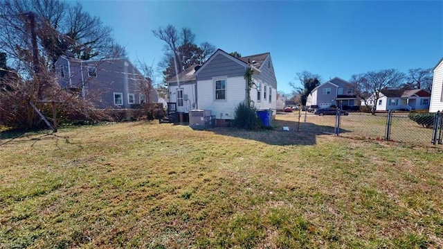 view of yard featuring fence and a residential view