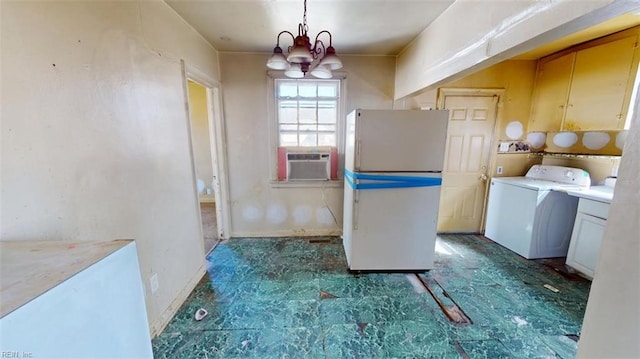 laundry area featuring cabinet space, dark floors, washer / clothes dryer, cooling unit, and a notable chandelier