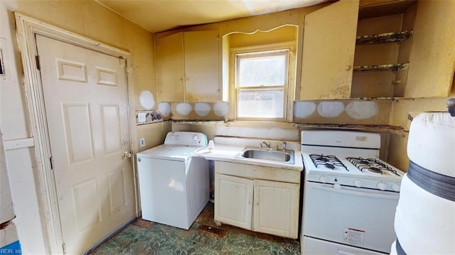 kitchen with washer / clothes dryer, light countertops, a sink, and white gas stove