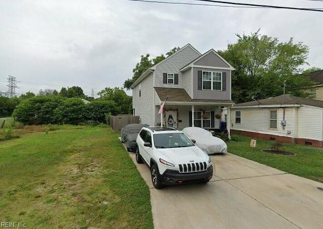 view of front of property with a front yard and fence