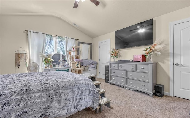 bedroom featuring lofted ceiling, a ceiling fan, and light colored carpet