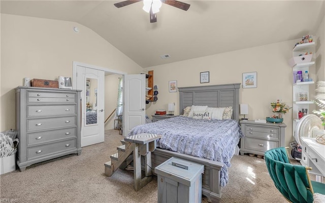 bedroom with vaulted ceiling, visible vents, carpet floors, and ceiling fan