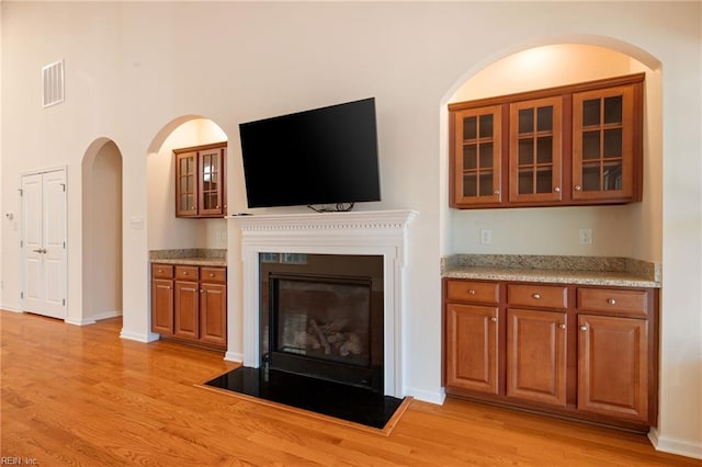 unfurnished living room featuring light hardwood / wood-style flooring