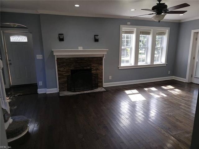 unfurnished living room featuring crown molding, dark wood-type flooring, and ceiling fan