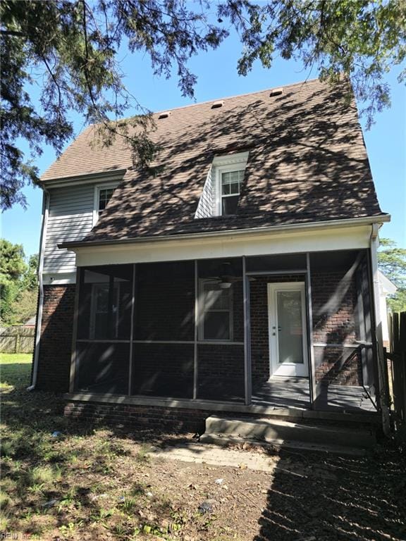 rear view of house with a sunroom