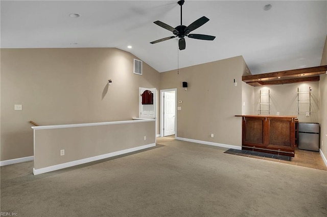 carpeted empty room with ceiling fan and lofted ceiling