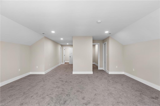 additional living space with lofted ceiling, baseboards, and recessed lighting