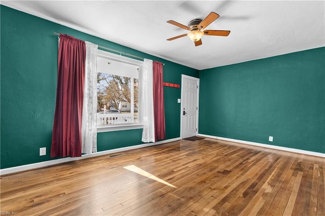 unfurnished room featuring hardwood / wood-style flooring and ceiling fan