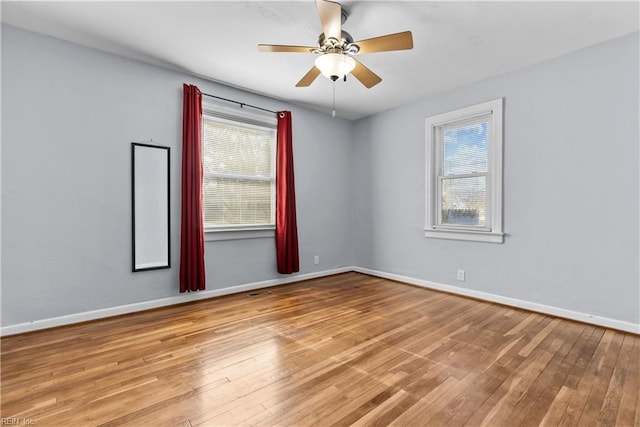 spare room with ceiling fan and light hardwood / wood-style flooring