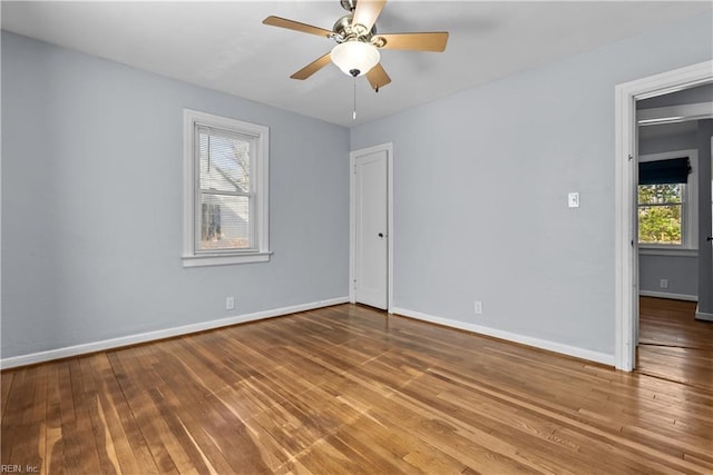 unfurnished room featuring ceiling fan and hardwood / wood-style floors