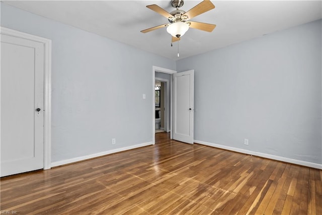 spare room featuring hardwood / wood-style flooring and ceiling fan