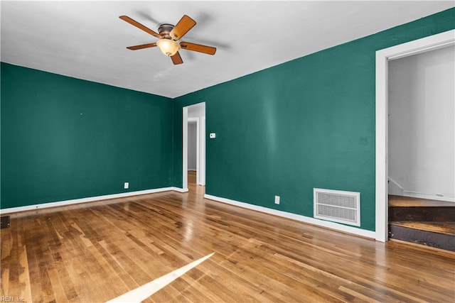 unfurnished room with wood-type flooring and ceiling fan