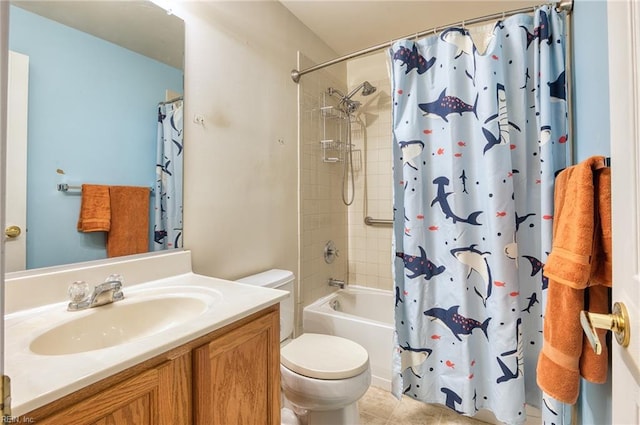 full bathroom with tile patterned floors, shower / bath combo with shower curtain, vanity, and toilet