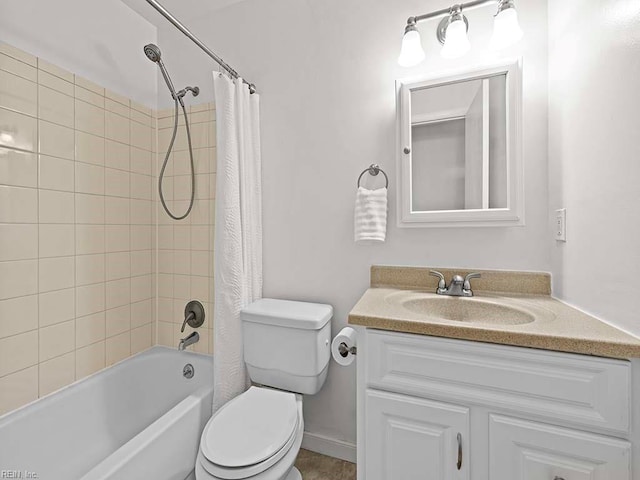 full bathroom with shower / bath combination with curtain, vanity, and toilet