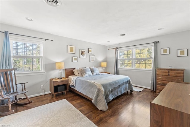 bedroom with baseboards, visible vents, dark wood-type flooring, and recessed lighting