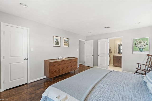 bedroom featuring ensuite bathroom, recessed lighting, wood finished floors, visible vents, and baseboards