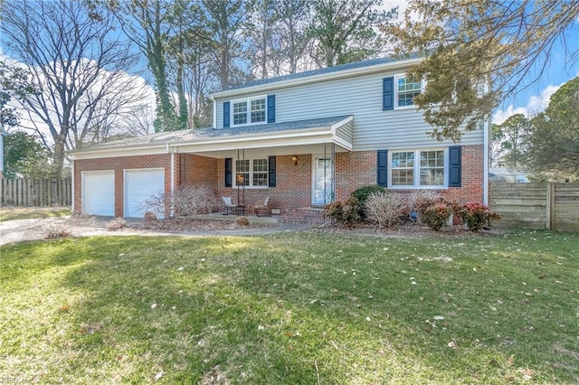 traditional-style house featuring a garage, brick siding, fence, and driveway