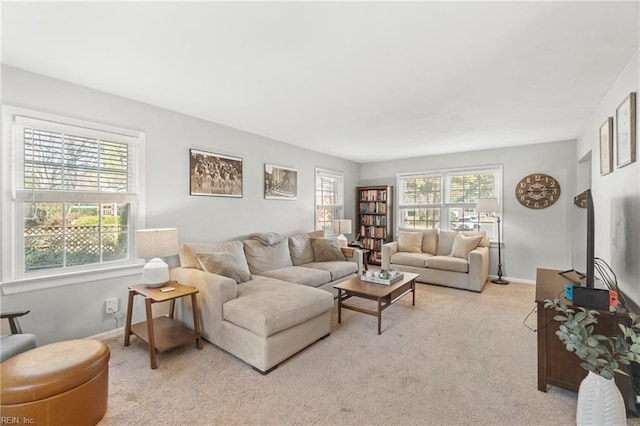 living room with light colored carpet and baseboards