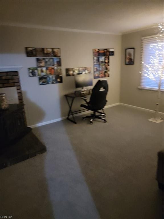 carpeted home office featuring crown molding