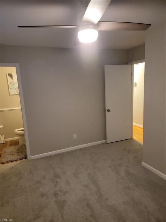 unfurnished bedroom with carpet, connected bathroom, and ceiling fan