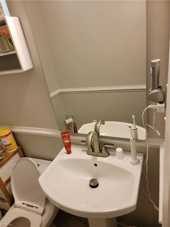 bathroom with toilet and sink