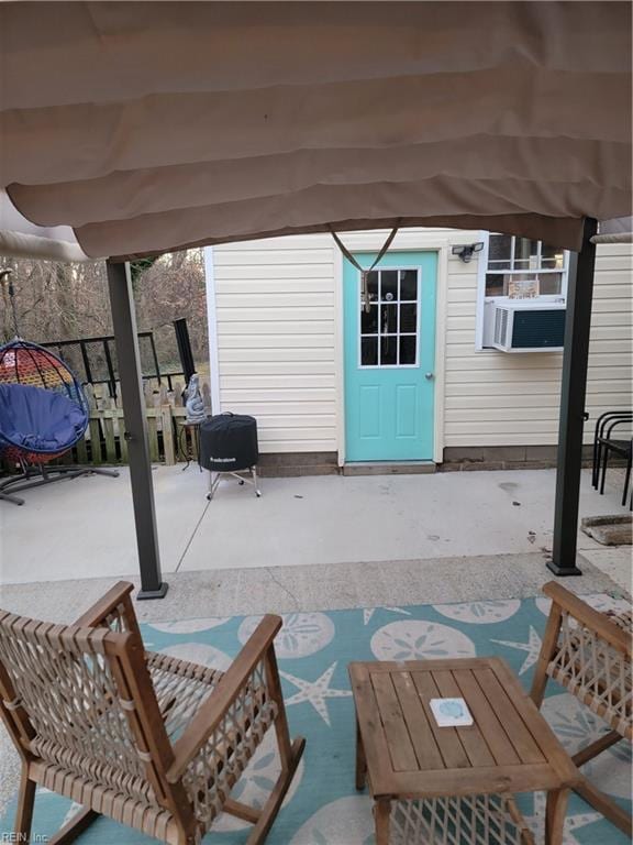 view of patio / terrace featuring an outbuilding and cooling unit